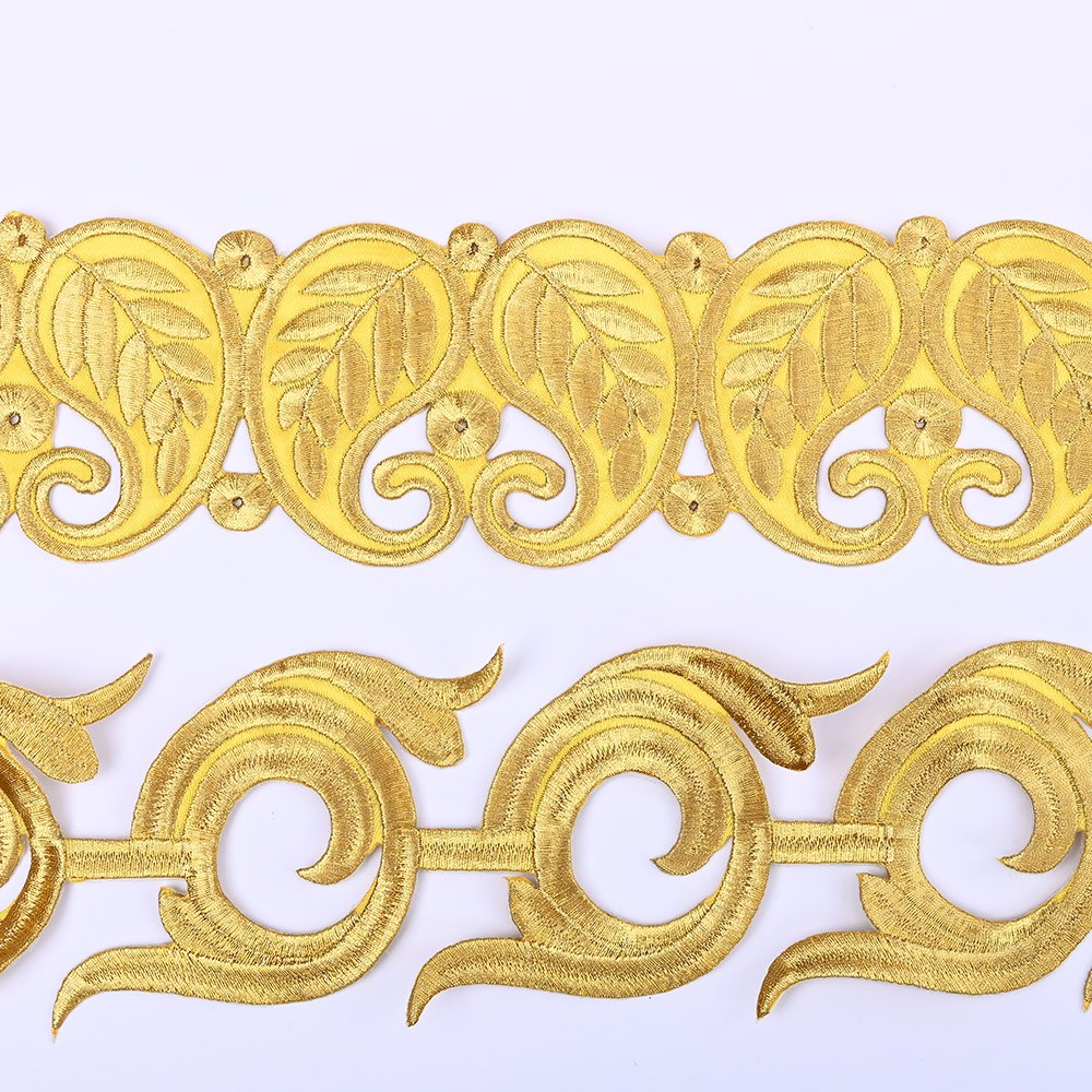 Gold metallic embroidered trims with back adhesive laid flat, paisley and scroll border designs