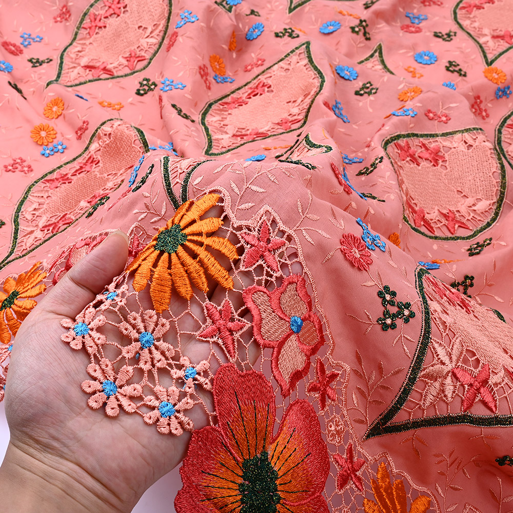 Hand-sewn 3D appliqué flowers on coral lace fabric border
