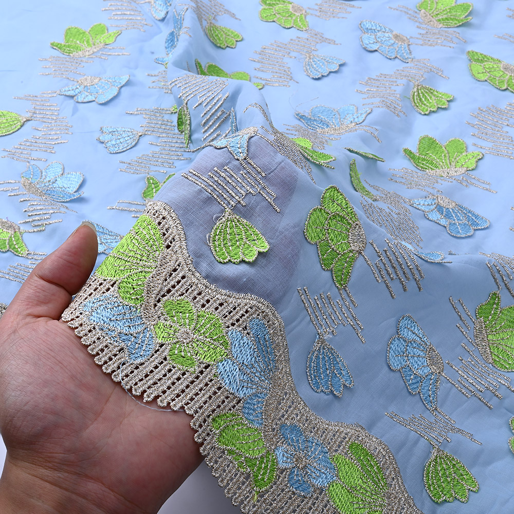 Beige guipure scalloped border of sky blue 3D lace fabric