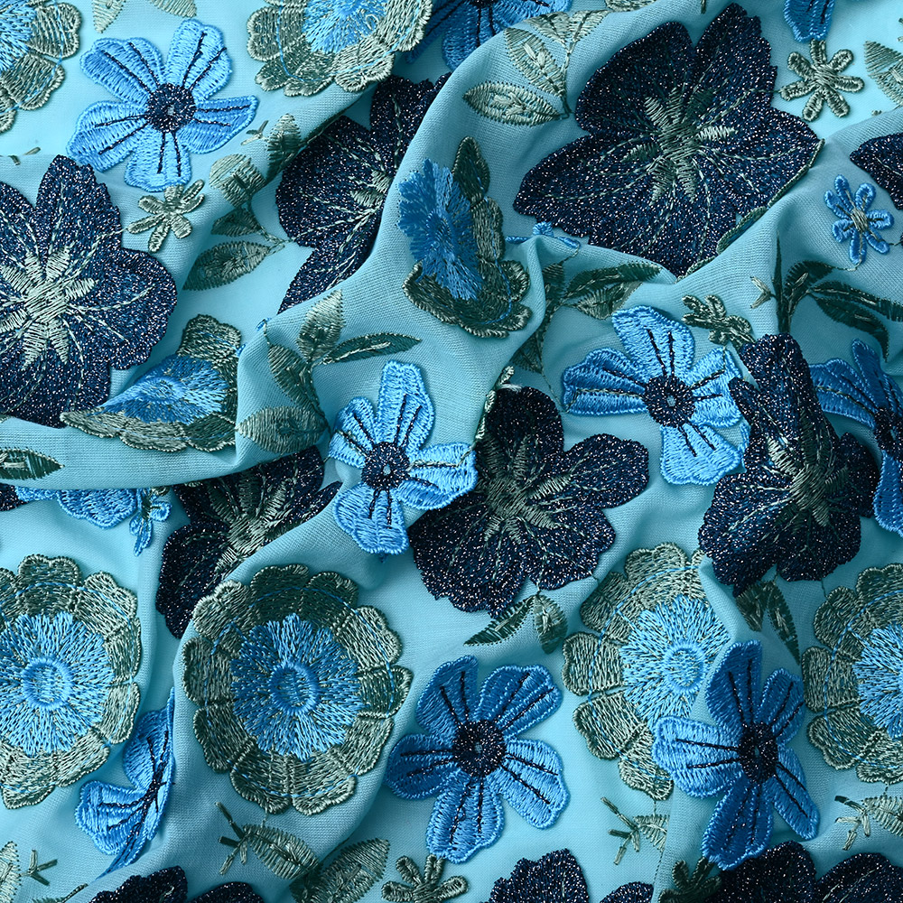 Layered 3D petals and leaves on aqua blue embroidered lace fabric
