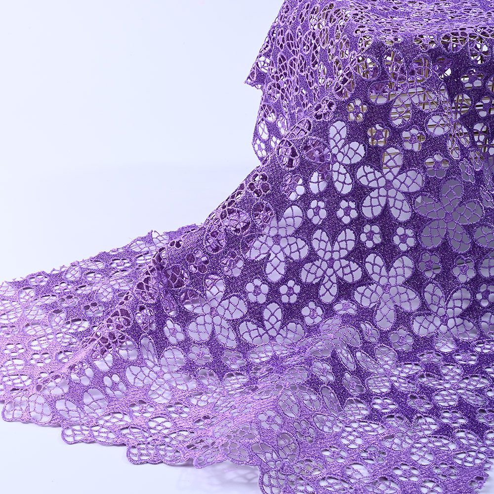 Scalloped flower border of lavender guipure lace fabric